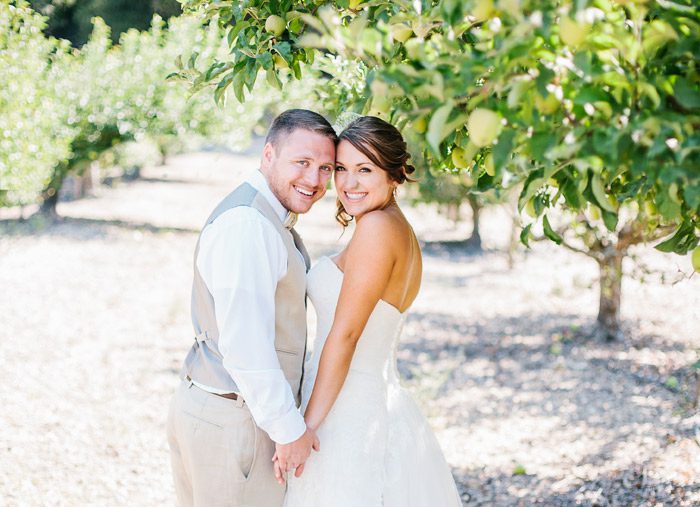 Bride and Groom in apple orchard