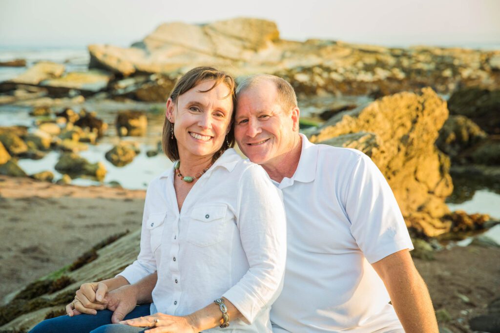 husband and wife photo in pismo beach at low tide