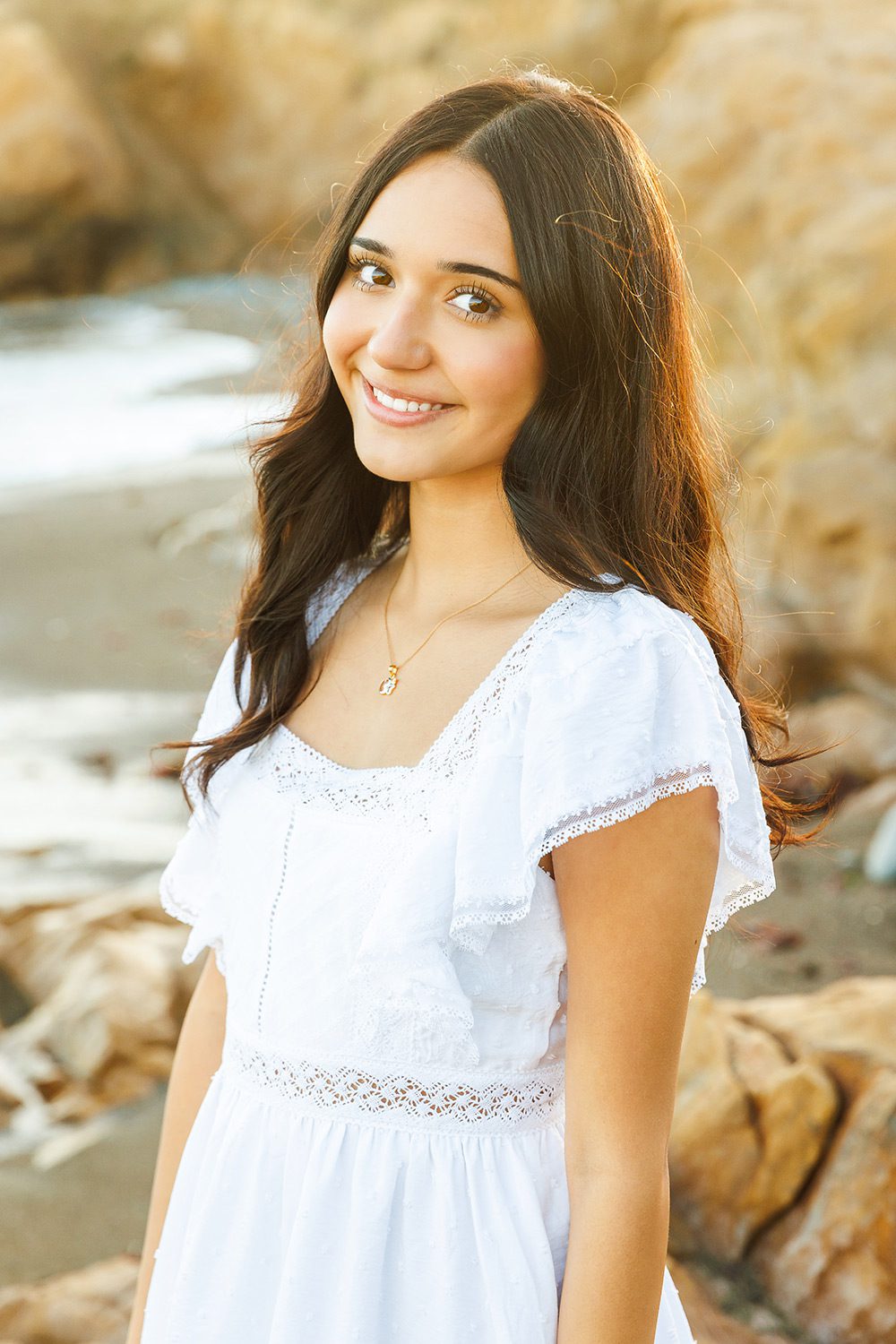 Close-up natural light headshot of a high school senior taken at a coastal outdoor location in Cambria, CA.