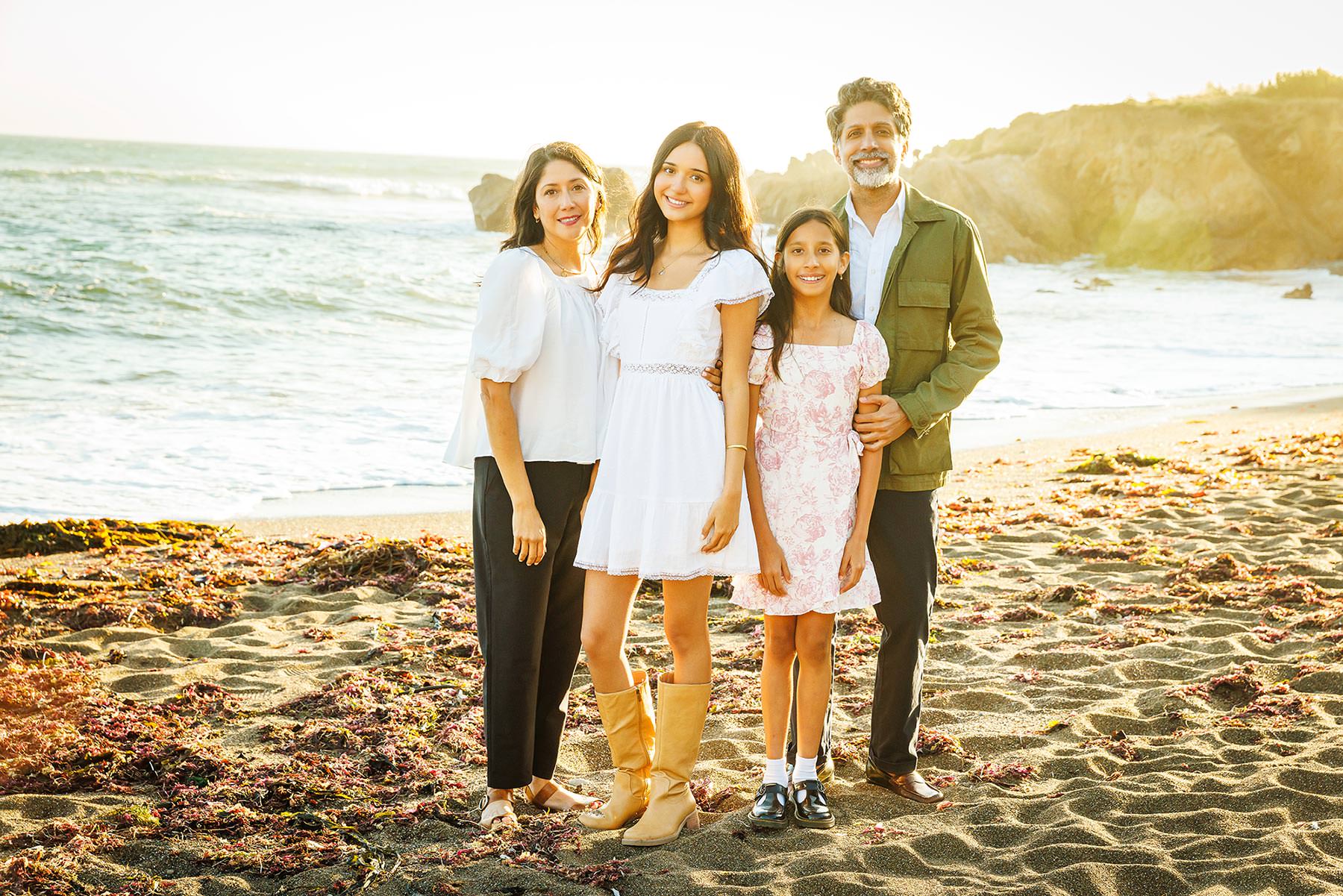 Full family portrait session on the beach at Moonstone Drive in Cambria, CA, during a senior milestone session.