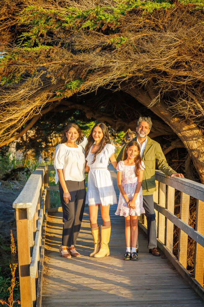 Family portrait along the coastal boardwalk near Moonstone Beach in Cambria, California.