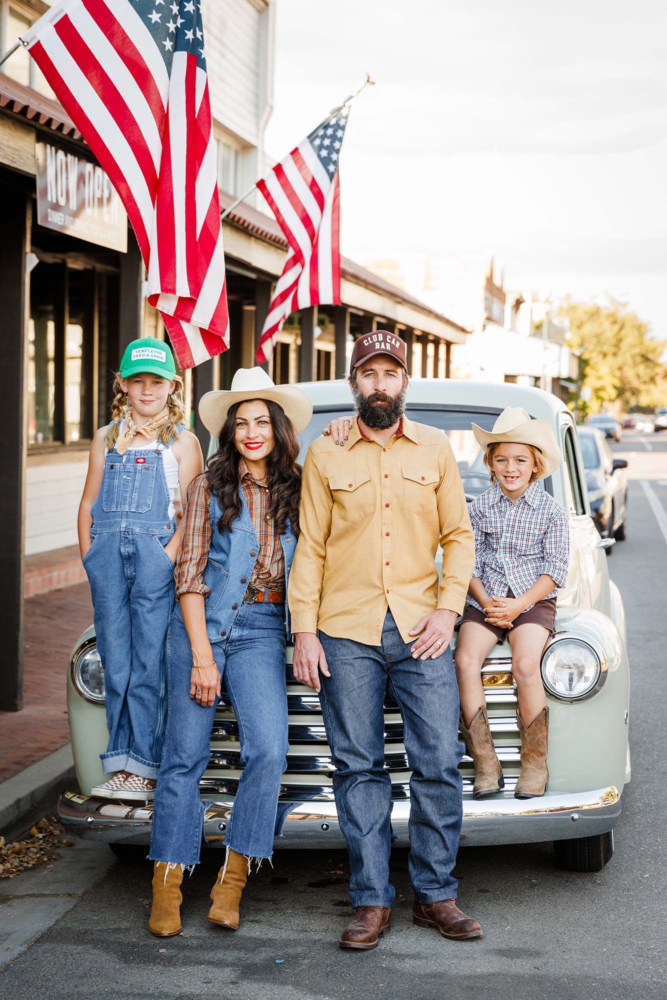Vintage-style outdoor family portrait with a classic truck on Main Street in Templeton, CA.