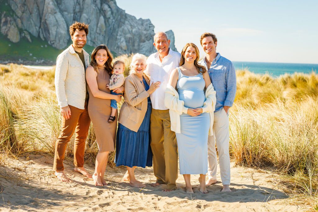 Multigenerational family portrait near Morro Rock in Morro Bay, California