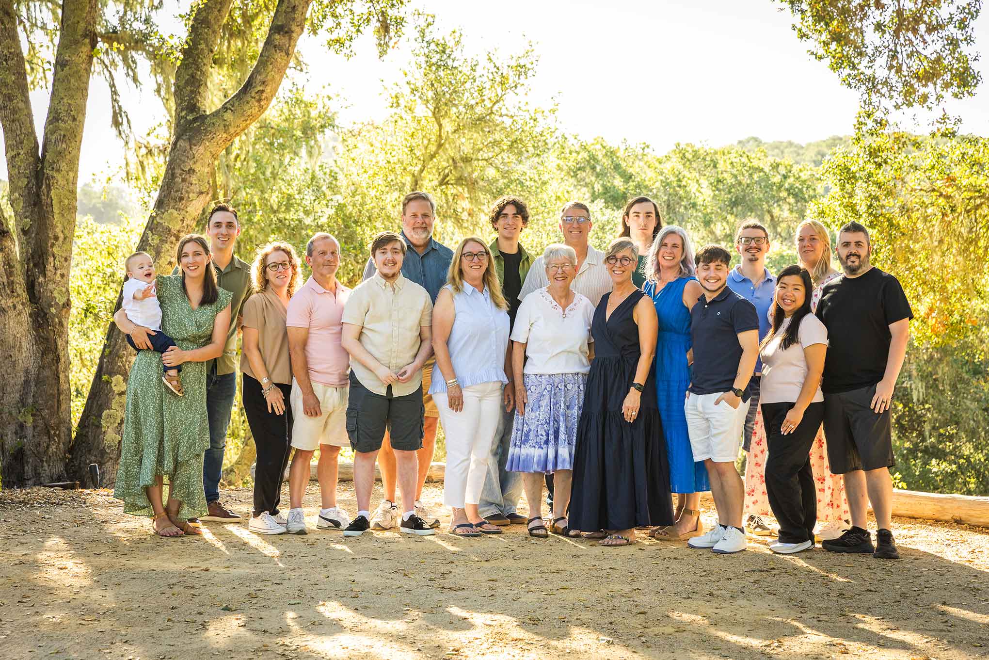 Extended family portrait beneath the oak trees at Oak & Vine in Templeton, California